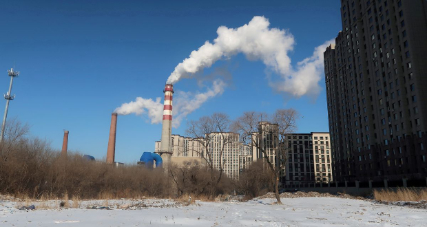 A coal-fired heating complex is seen behind the ground covered by snow in Harbin, Heilongjiang province, China November 15, 2019. Picture taken November 15, 2019. REUTERS/Muyu Xu//File Photo