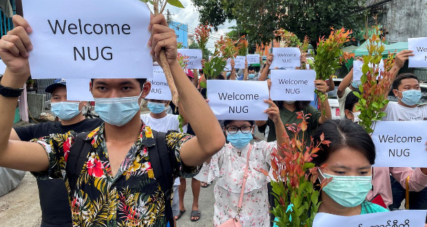 Anti-government protesters hold placards to show their support and welcome the new National Unity Government found by ousted NLD legislators and call to continue strike from traditional new year in Myanmar, in Yangon, Myanmar, April 17, 2021. REUTERS/Stringer/File Photo
