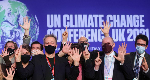 Delegates pose for photos - but did COP26 go far enough?