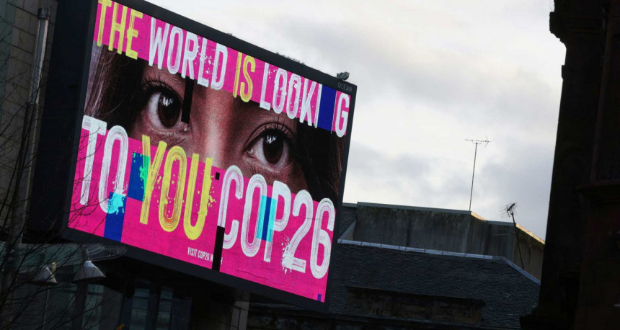An advertising board is seen during the UN Climate Change Conference (COP26) in Glasgow, Scotland on November 7, 2021. Photo: Reuters/Yves Herman