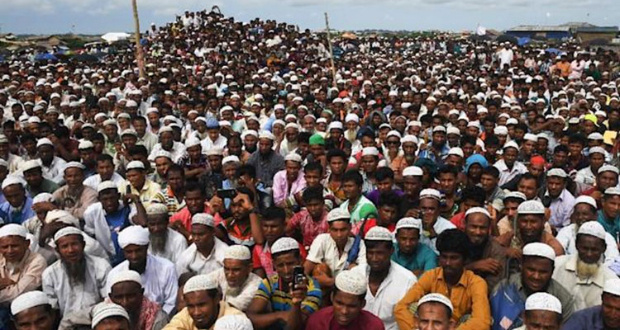 Rohingya refugees attend a ceremony in Bangladesh to remember the first anniversary of the military crackdown. (AFP Photo/Dibyangshu SARKAR) Click here to g