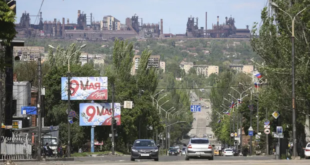 A street in Mariupol, with the Azovstal steel plant in the background. Photograph: Alexei Alexandrov/AP
