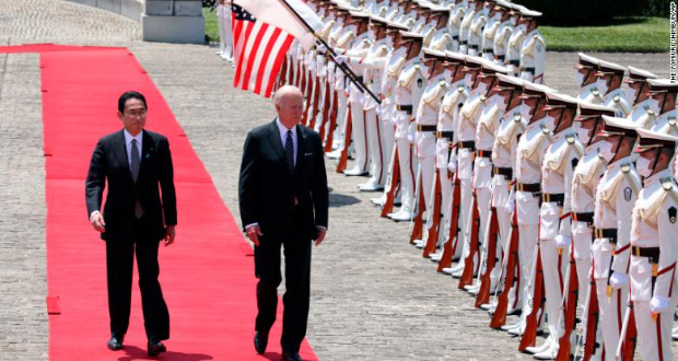 President Joe Biden receives a salute from a guard of honor with Japan's Prime Minister Fumio Kishida ahead of their meeting in Tokyo on May 23, 2022.