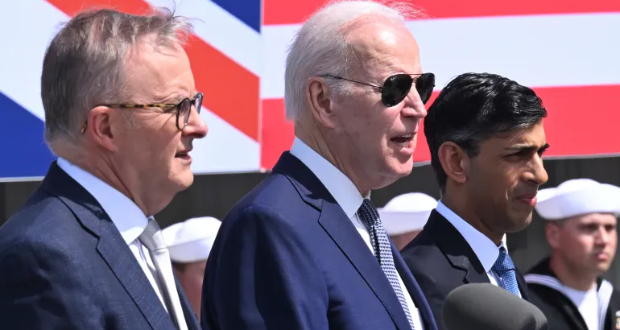 UK Prime Minister Rishi Sunak (right), US President Joe Biden (centre) and Australian Prime Minister Anthony Albanese (left), announce details of the AUKUS trilateral pact in March [File: Leon Neal/Pool via AP]