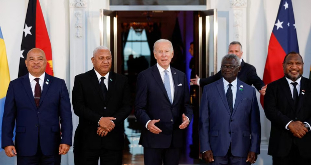 U.S. President Joe Biden speaks as he poses with Federated States of Micronesia's President David Panuelo, Fiji's Prime Minister Frank Bainimarama, Solomon Islands Prime Minister Manasseh Sogavare and Papua New Guinea's Prime Minister James Marape and other leaders from the U.S.- Pacific Island Country Summit, at the White House in Washington, U.S. September 29, 2022. REUTERS/Jonathan Ernst/File Photo