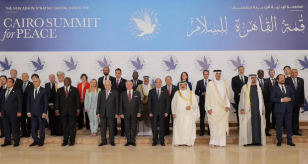 Egyptian President Abdel Fattah el-Sisi poses for a family photo with other leaders before the Cairo international summit for peace in the Middle East in the New Administrative Capital (NAC), east of Cairo, Egypt, October 21, 2023. [The Egyptian Presidency/Handout via Reuters]