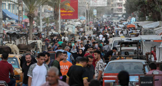 Palestinians displaced by the Israel-Hamas war shopping at a market in Khan Yunis in Gaza this week. Credit...Yousef Masoud for The New York Times