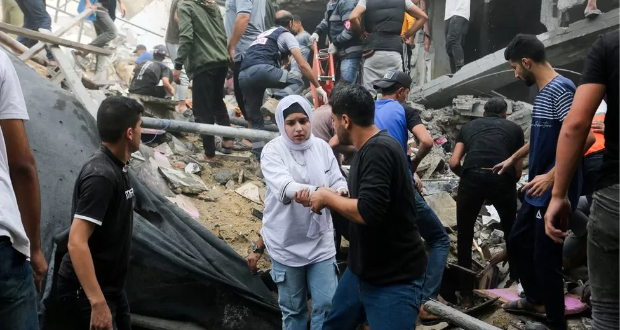 Palestinians search for casualties at the site of an Israeli strike on a house in the southern Gaza Strip last week