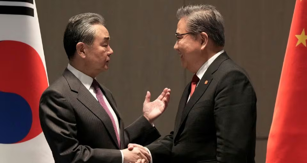South Korean Foreign Minister Park Jin, right, talks with his Chinese counterpart Wang Yi prior to a meeting in Busan, South Korea, Sunday, Nov. 26, 2023. Ahn Young-joon/Pool via REUTERS