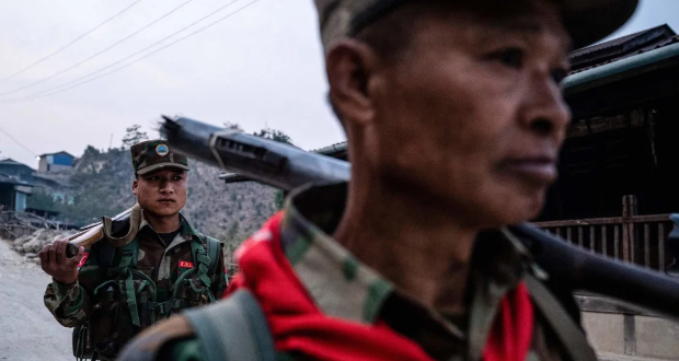 In this photo taken on March 9, 2023 members of ethnic rebel group Ta'ang National Liberation Army (TNLA) patrol near Namhsan Township in Myanmar's northern Shan State.