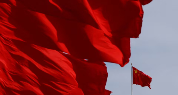 Flags flutter in the wind during the opening ceremony of the Belt and Road Forum (BRF) to mark the 10th anniversary of the Belt and Road Initiative at the Great Hall of the People in Beijing, China October 18, 2023. REUTERS/Edgar Su