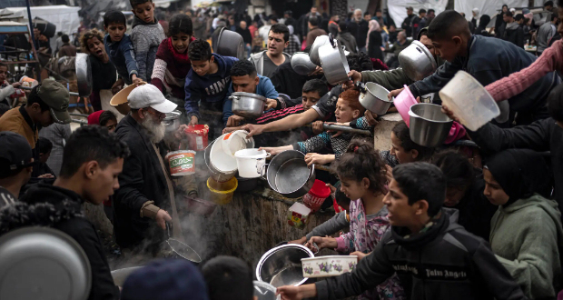 Palestinians lining up for food in Rafah, in the southern Gaza Strip, on Thursday.Credit...Fatima Shbair/Associated Press