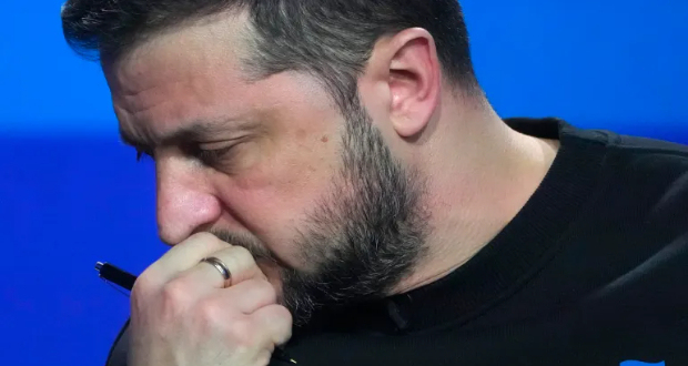 Ukrainian President Volodymyr Zelenskyy reacts during his end-of-the-year news conference in Kyiv, Ukraine, December 19, 2023 [Efrem Lukatsky/AP Photo]