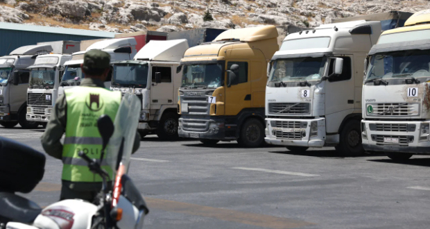 A convoy of trucks carrying humanitarian aid is seen parked after crossing the Syrian Bab al-Hawa border crossing with Turkey, on July 10, 2023.