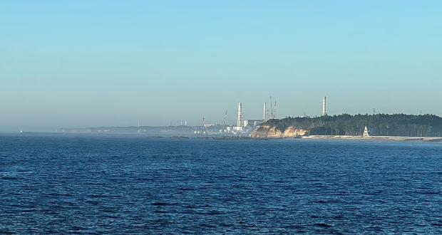A view of the Fukushima Daiichi nuclear power plant after it started releasing treated radioactive water into the Pacific Ocean, seen from the nearby Ukedo fishing port in Namie town, Fukushima Prefecture, Japan, Aug. 25, 2023. REUTERS/Tom Bateman/File Photo