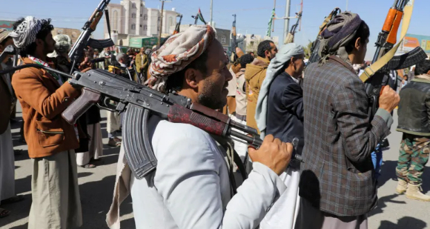 Newly recruited Houthi fighters hold up firearms during a ceremony at the end of their training in Sanaa, Yemen, on January 11 [File: Khaled Abdullah/Reuters]