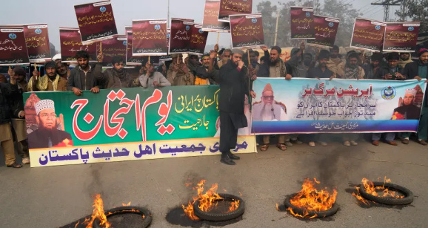 Supporters of a religious group 'Markazi Jamiyat Ahle Hadith Pakistan' burn tires and hold a demonstration to condemn Iran strike in the Pakistani border area, in Lahore, Pakistan, Friday, January 19, 2024 [KM Chaudary/AP Photo]
