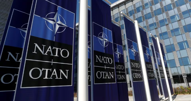 Banners displaying the NATO logo are placed at the entrance of new NATO headquarters during the move to the new building, in Brussels, Belgium April 19, 2018. REUTERS/Yves Herman/File Photo
