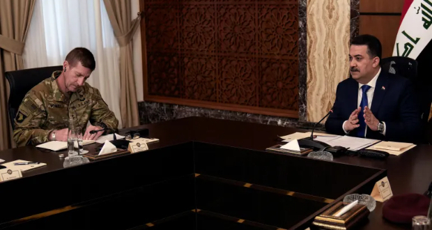 Iraqi Prime Minister Mohammed Shia al-Sudani and Major General Joel 'JB' Vowell attend the first session of negotiations between Iraq and the US to wind down the International Coalition mission in Baghdad, Iraq [Hadi Mizban/Pool via Reuters]