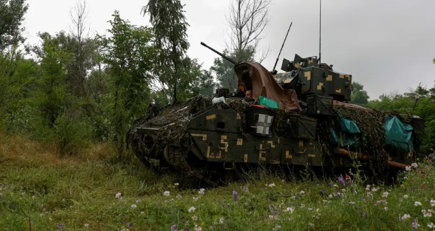 A Ukrainian serviceman drives an M2 Bradley infantry fighting vehicle at a position near Zaporizhzhia, Ukraine, June 26, 2023  Photo by Rfe/Rl/Serhii Nuzhnenko via Reuters