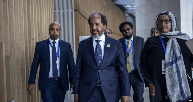 President of Somalia Hassan Sheikh Mohamud, center, makes his way to conduct a press conference following the 37th Ordinary Session of the Assembly of the African Union at the AU headquarters in Addis Ababa, Feb. 17, 2024.