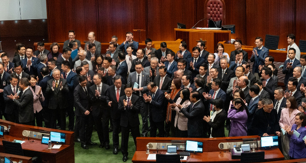 John Lee, chief executive (front center) of the Hong Kong Special Administrative Region (HKSAR), applauds with lawmakers at the Legislative Council of the HKSAR on March 19, 2024, following the passing of a safeguarding national security bill, a milestone in completing the legislation of Article 23 of the Basic Law of the HKSAR on the same day. Photo: VCG