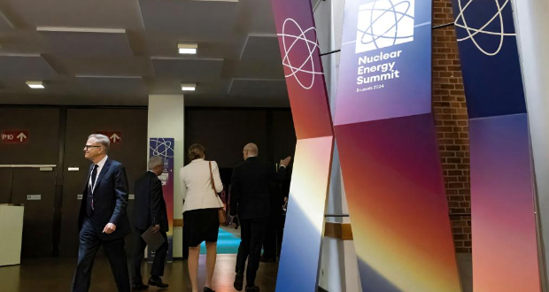 People walk at the venue of the Nuclear Energy Summit in Brussels, Belgium, March 21, 2024. The world's first Nuclear Energy Summit convened here on Thursday, highlighting the role of nuclear energy in addressing global challenges such as reducing fossil fuel use, enhancing energy security, and boosting economic development. (Xinhua/Meng Dingbo)