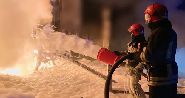 Emergency services personnel work to extinguish a fire in Ivano-Frankivsk region, Ukraine, on Saturday [Handout/State Emergency Service of Ukraine via AP]