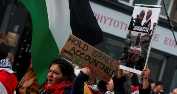 People take part in a protest in support of Palestinians in Gaza in Brussels, Belgium [File: Yves Herman/Reuters]